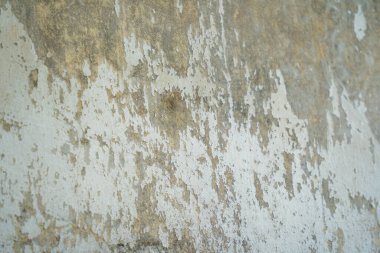 Texture of old gray concrete wall for background. Rough texture on gray wall rough form due to peeling paint layer due to rain