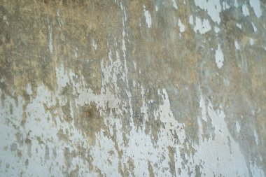 Texture of old gray concrete wall for background. Rough texture on gray wall rough form due to peeling paint layer due to rain
