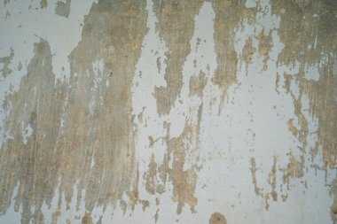 Texture of old gray concrete wall for background. Rough texture on gray wall rough form due to peeling paint layer due to rain