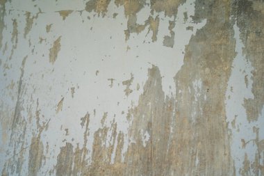 Texture of old gray concrete wall for background. Rough texture on gray wall rough form due to peeling paint layer due to rain