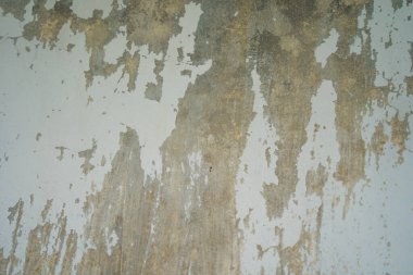 Texture of old gray concrete wall for background. Rough texture on gray wall rough form due to peeling paint layer due to rain