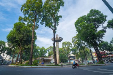 Wide angle view of Lotus pillar - An iconic architecture at Turtle lake (Ho Con Rua) with blue sky in Saigon.