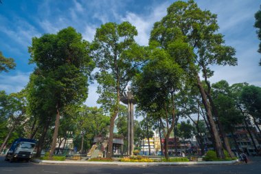 Wide angle view of Lotus pillar - An iconic architecture at Turtle lake (Ho Con Rua) with blue sky in Saigon.