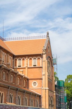 Focus Saigon Notre-Dame Cathedral Basilica (Basilica of Our Lady of The Immaculate Conception) in Ho Chi Minh City, Saigon, Vietnam under renovation with blue sky background.