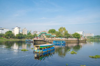 Visitors to Phu Chau Temple (Phu Chau Mieu) by boats, is located in the middle of a branch of the Saigon River, floating on Vam Thuat river