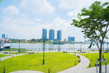 Ho Chi Minh city, Vietnam - FEB 13 2022: skyline with landmark 81 skyscraper, a new cable-stayed bridge is building connecting Thu Thiem peninsula and District 1 across the Saigon River.