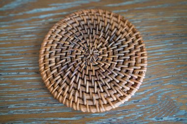 Texture background: yellow and brown striped straw hat pattern. Bamboo braided sunscreen headdress for heat. Broad brim summer hat. Panama weaving