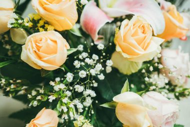 Bouquet of fresh red roses, flower bright background. Close up of a red rose with water droplets.