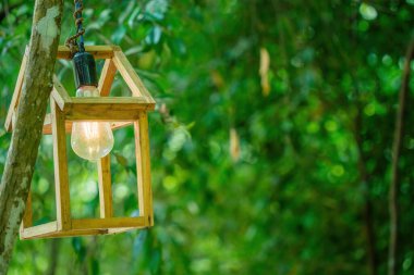 Close up Several LED bulbs on green bokeh background. Saving energy, eco concept. Ftat lay, copy space. Light bulbs lie in a row.