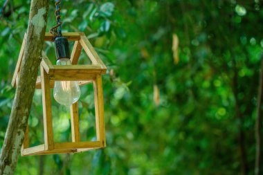 Close up Several LED bulbs on green bokeh background. Saving energy, eco concept. Ftat lay, copy space. Light bulbs lie in a row.