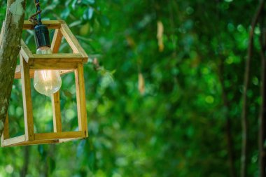 Close up Several LED bulbs on green bokeh background. Saving energy, eco concept. Ftat lay, copy space. Light bulbs lie in a row.
