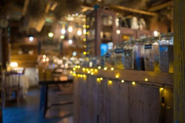Blurred background Interior of cozy coffee shop. Contemporary design in loft style, modern dining place and bar counter, copy space.