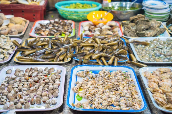 Variety of fresh seafood on market. Fresh salmon, sea bass, red snapper, mackerel, crab, lobster, shrimp, black mussels, oyster, scallop and octopus on ice in market