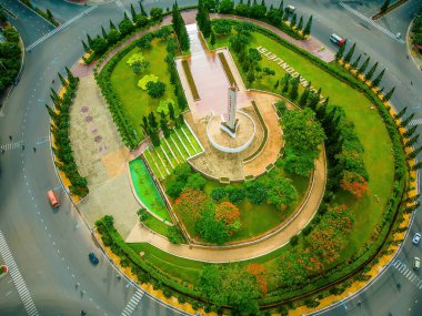 Vung Tau view from above, with traffic roundabout, house, Vietnam war memorial in Vietnam. This is the biggest roundabout in Vung Tau.