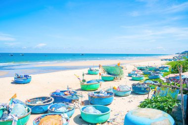 Aerial view of fishing village in Long Hai, Phuoc Hai. Tropical Seascape with a boat on sandy beach at cloudy. Beautiful tropical beach with small boat for travel and vacation in holiday relax time.