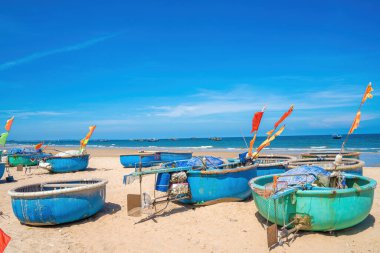 Aerial view of fishing village in Long Hai, Phuoc Hai. Tropical Seascape with a boat on sandy beach at cloudy. Beautiful tropical beach with small boat for travel and vacation in holiday relax time.