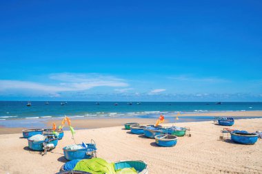 Aerial view of fishing village in Long Hai, Phuoc Hai. Tropical Seascape with a boat on sandy beach at cloudy. Beautiful tropical beach with small boat for travel and vacation in holiday relax time.