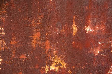Rusty sheet of metal background. Old style of closed red steel door and rust , Rusty old folding metal door to the car garage. Texture background.