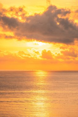 Calm sea with sunset sky and sun through the clouds over. Calm sea with sunset sky and sun through the clouds over. Meditation ocean and sky background. Tranquil seascape. Horizon over the water.