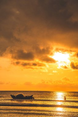 Calm sea with sunset sky and sun through the clouds over. Calm sea with sunset sky and sun through the clouds over. Meditation ocean and sky background. Tranquil seascape. Horizon over the water.