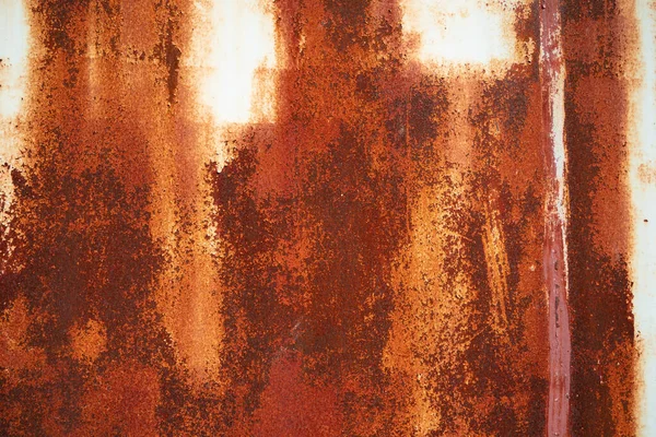 Rusty sheet of metal background. Old style of closed red steel door and rust , Rusty old folding metal door to the car garage. Texture background.