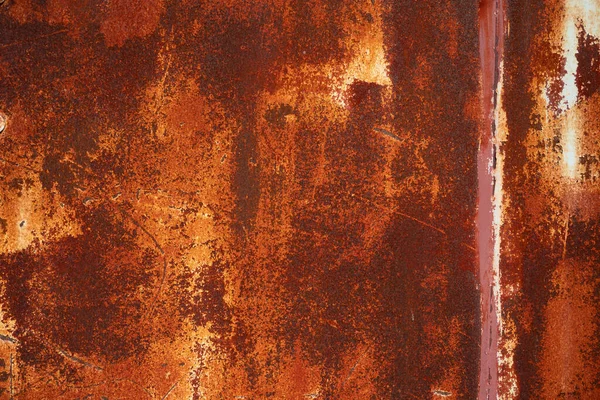 Rusty sheet of metal background. Old style of closed red steel door and rust , Rusty old folding metal door to the car garage. Texture background.