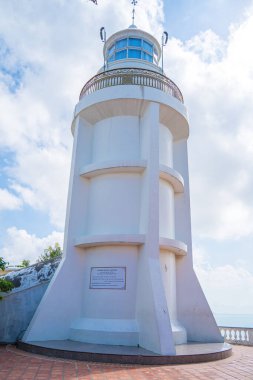 Focus white Lighthouse in Vung Tau. The most visited tourist location in the Vung Tau city and famous Lighthouse captured with blue sky and cloud.