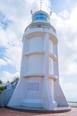 Focus white Lighthouse in Vung Tau. The most visited tourist location in the Vung Tau city and famous Lighthouse captured with blue sky and cloud.