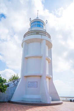Focus white Lighthouse in Vung Tau. The most visited tourist location in the Vung Tau city and famous Lighthouse captured with blue sky and cloud.
