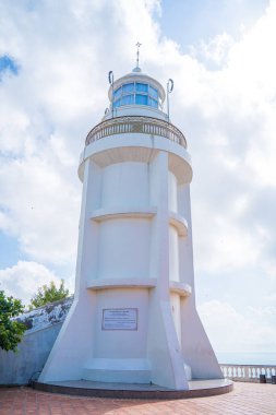Focus white Lighthouse in Vung Tau. The most visited tourist location in the Vung Tau city and famous Lighthouse captured with blue sky and cloud.