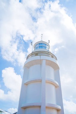 Focus white Lighthouse in Vung Tau. The most visited tourist location in the Vung Tau city and famous Lighthouse captured with blue sky and cloud.