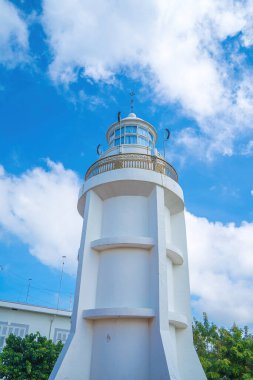 Focus white Lighthouse in Vung Tau. The most visited tourist location in the Vung Tau city and famous Lighthouse captured with blue sky and cloud.