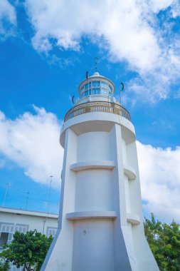 Focus white Lighthouse in Vung Tau. The most visited tourist location in the Vung Tau city and famous Lighthouse captured with blue sky and cloud.