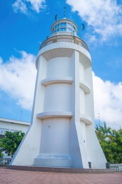 Focus white Lighthouse in Vung Tau. The most visited tourist location in the Vung Tau city and famous Lighthouse captured with blue sky and cloud.