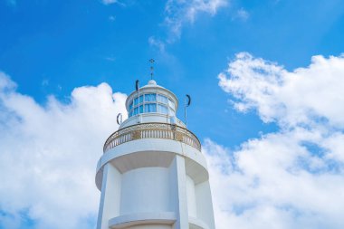 Focus white Lighthouse in Vung Tau. The most visited tourist location in the Vung Tau city and famous Lighthouse captured with blue sky and cloud.