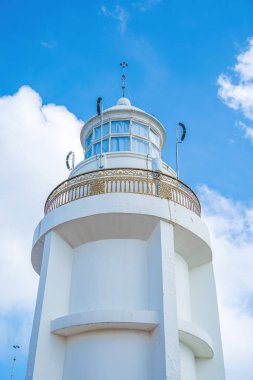 Focus white Lighthouse in Vung Tau. The most visited tourist location in the Vung Tau city and famous Lighthouse captured with blue sky and cloud.