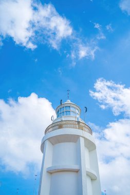 Focus white Lighthouse in Vung Tau. The most visited tourist location in the Vung Tau city and famous Lighthouse captured with blue sky and cloud.