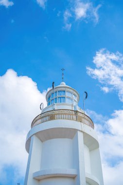 Focus white Lighthouse in Vung Tau. The most visited tourist location in the Vung Tau city and famous Lighthouse captured with blue sky and cloud.