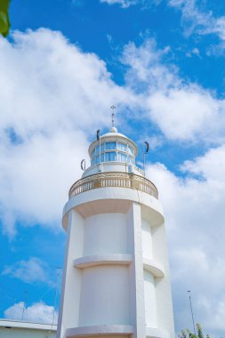 Focus white Lighthouse in Vung Tau. The most visited tourist location in the Vung Tau city and famous Lighthouse captured with blue sky and cloud.