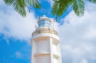 Focus white Lighthouse in Vung Tau. The most visited tourist location in the Vung Tau city and famous Lighthouse captured with blue sky and cloud.