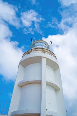 Focus white Lighthouse in Vung Tau. The most visited tourist location in the Vung Tau city and famous Lighthouse captured with blue sky and cloud.