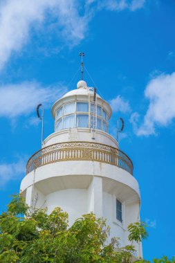 Focus white Lighthouse in Vung Tau. The most visited tourist location in the Vung Tau city and famous Lighthouse captured with blue sky and cloud.