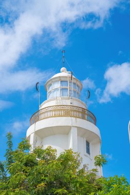 Focus white Lighthouse in Vung Tau. The most visited tourist location in the Vung Tau city and famous Lighthouse captured with blue sky and cloud.