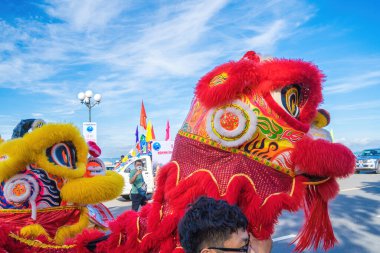 Vung Tau, VIETNAM - SEP 11 2022 : Lion and dragon dance during Nghinh Ong celebration. Group of people perform a traditional lion dance and dragon dance.