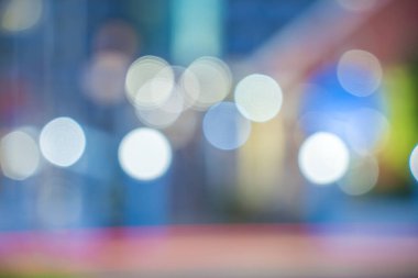 Abstract background of city street in bokeh. Blur focused urban abstract texture bokeh city lights. Design background Celebration