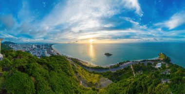 Aerial drone top view of ocean's beautiful waves crashing on the rocky island coast. Selective focus. Travel concept.