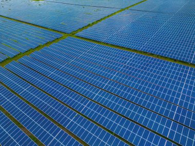 Top view of Solar panels on farm. Alternative source of electricity. solar panels absorb sunlight as a source of energy to generate electricity creating sustainable energy