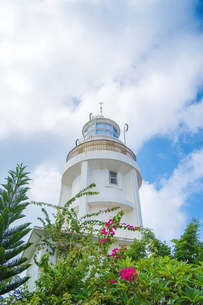 Focus white Lighthouse in Vung Tau. The most visited tourist location in the Vung Tau city and famous Lighthouse captured with blue sky and cloud.