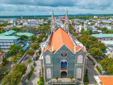Top view of the Chanh Toa Church in Ba Ria Vung Tau. The light shines on the statue of the Virgin Mary.