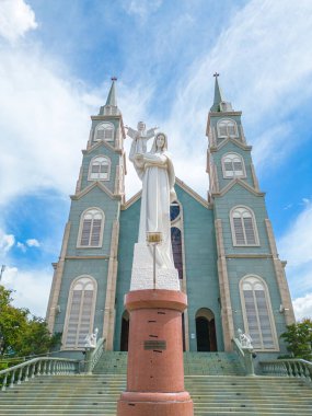 Top view of the Chanh Toa Church in Ba Ria Vung Tau. The light shines on the statue of the Virgin Mary.